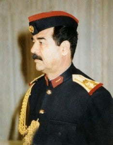 Saddam Hussein in Duty Uniform, public domain photo, courtesy Wikimedia