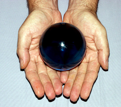 Curtis Offering a Blue Obsidian Ball from the Collection of Curtis Lang and Jane Sherry