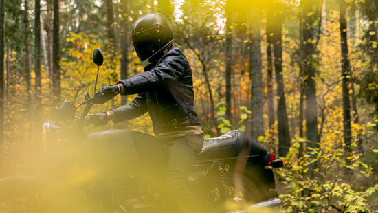 Motorcycle rider in the woods