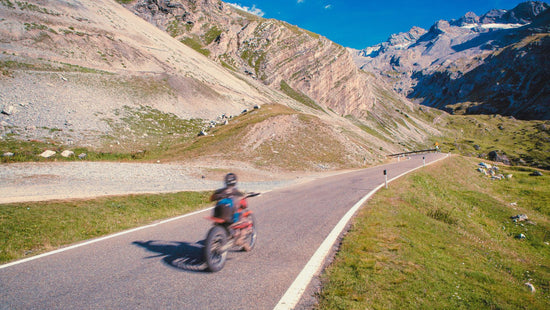 Motorcycle rider in Stelvio Pass Italy