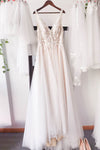 A-line V-neck Sleeveless Beaded Wedding Dress with a Brush/Sweep Train