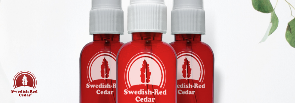 Three red spray bottles with Swedish red cedar oil.