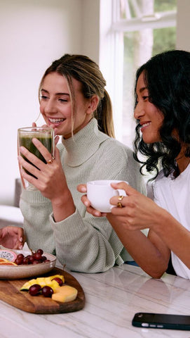 Women enjoying tea and coffee while wearing smart rings health trackers