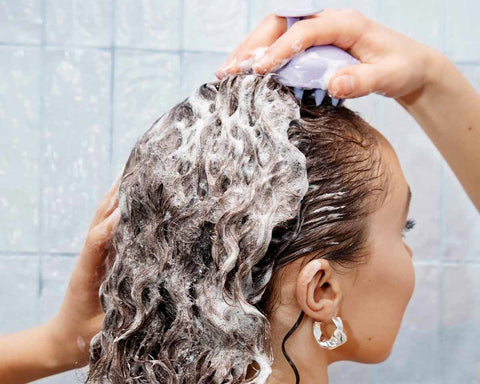 How to use a scalp brush in the shower