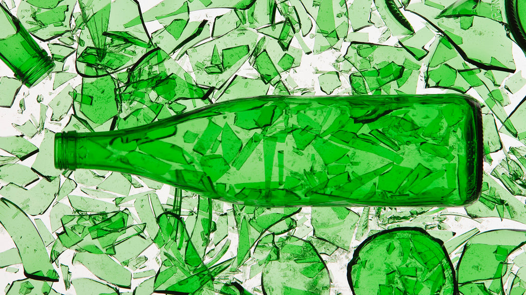 green glass bottle and pieces