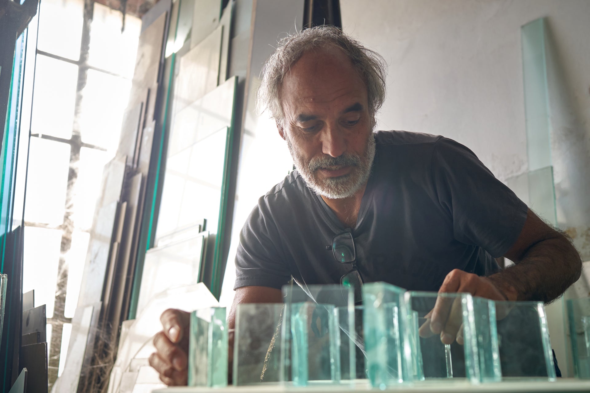 Glass hobbyist prepares glass panels for fusing