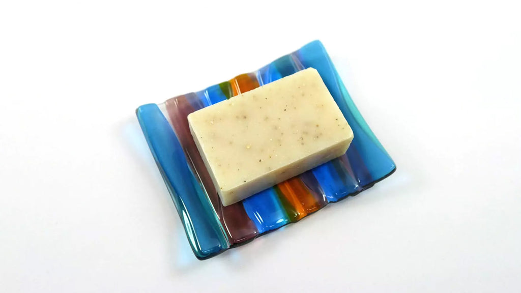 Glass soap dish with bar of soap