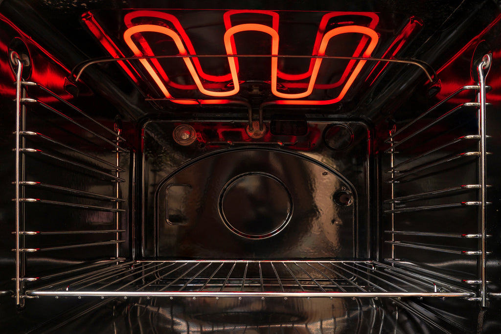 view inside conventional oven with glowing heating elements