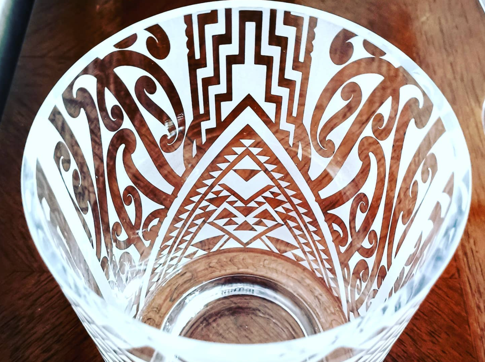 sandblasted glass flower vase with intricate design