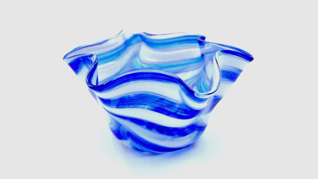 Blue and white glass vase made with glass slumping techniques.
