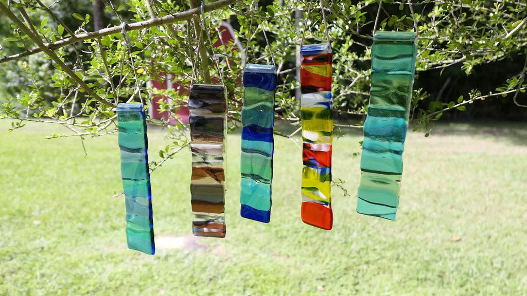 glass suncatchers hanging from tree