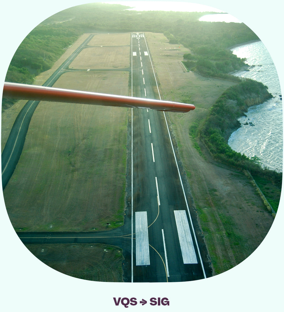 Looking back at a runway from a plane