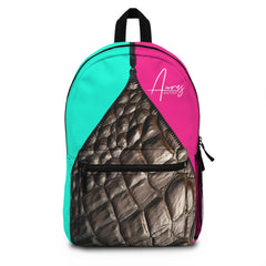 Auras Boutique's eye-catching customizable LUXE backpack! Pink & teal with a surprise crocodile print front pocket and black accents. Shop cute & practical bags.