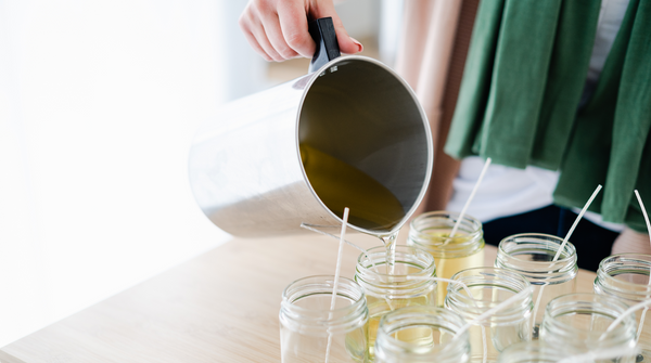 pouring soy candles in candle studio