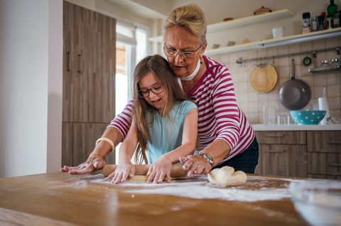 grandma baking cookies with granddaughter 