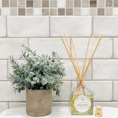 reed diffuser in tiled bathroom