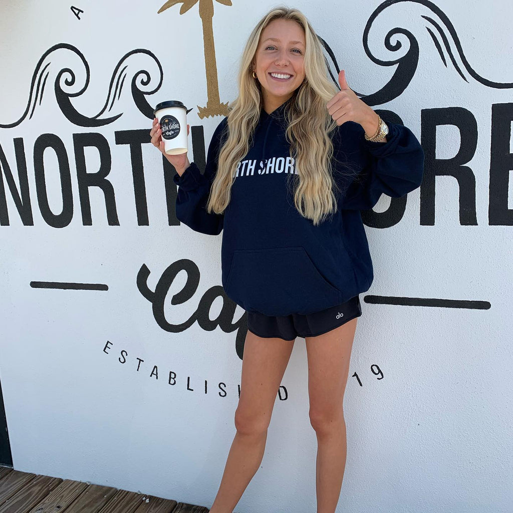 Standing outside the North Shore Cafe with custom printed Hoodie from Salty Printing