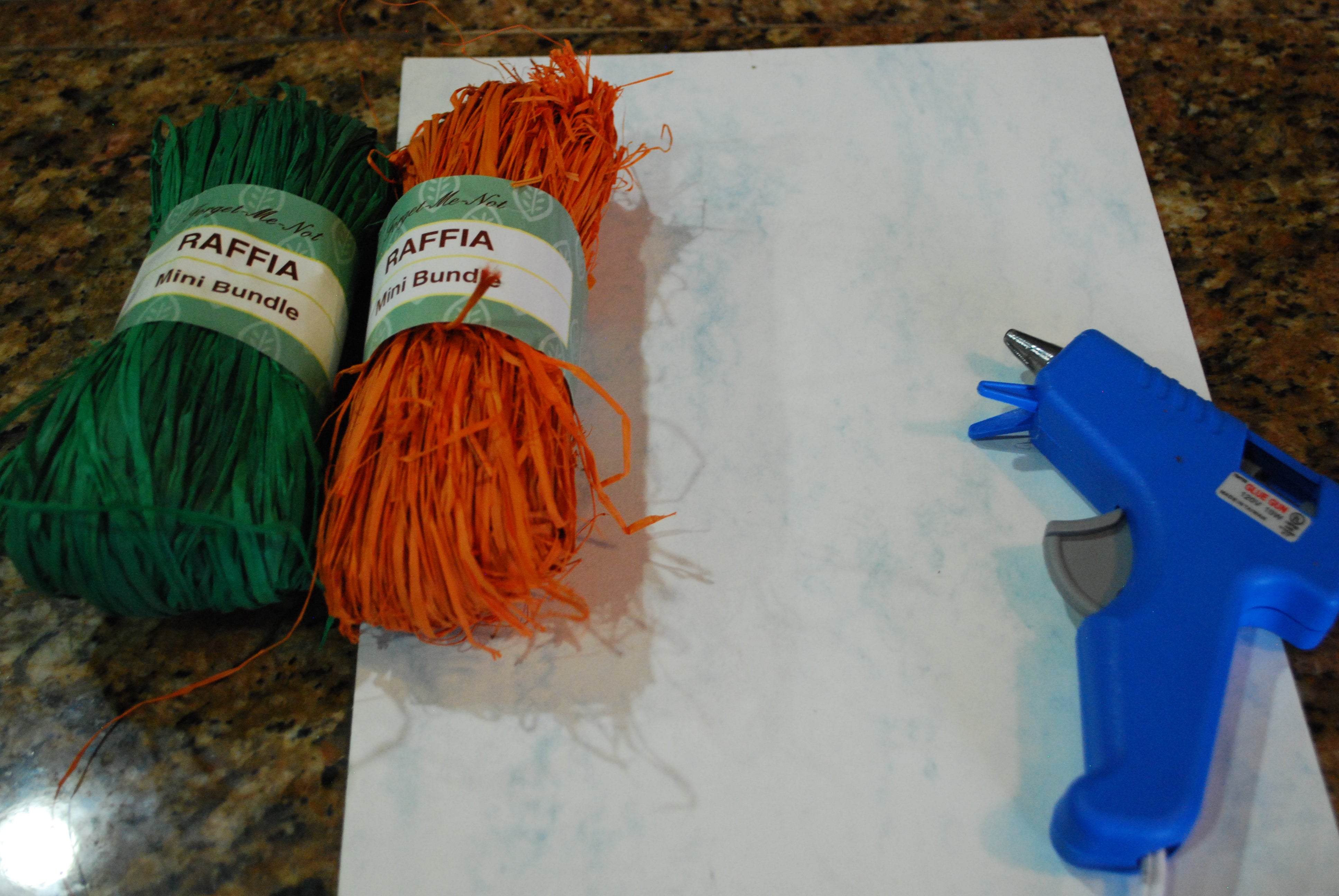 Supplies to make raffia carrots for Easter.