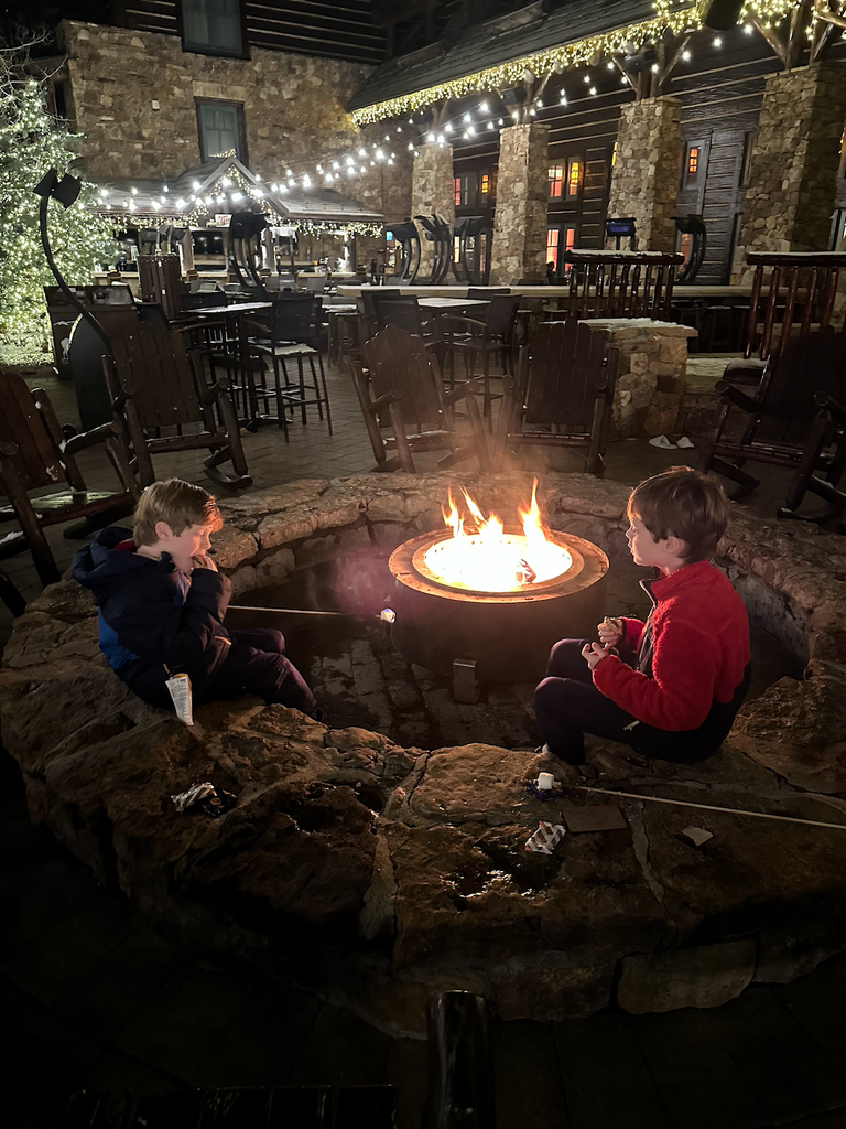 Erin's kids at a fire pit in Vail