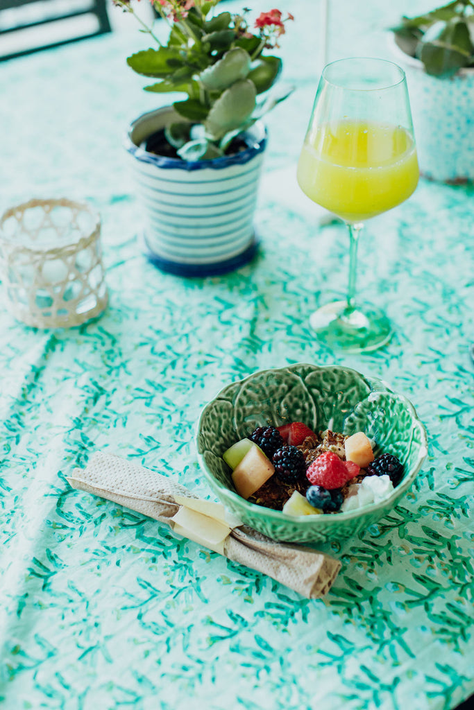 A yogurt parfait with fresh berries and granola and a mimosa!