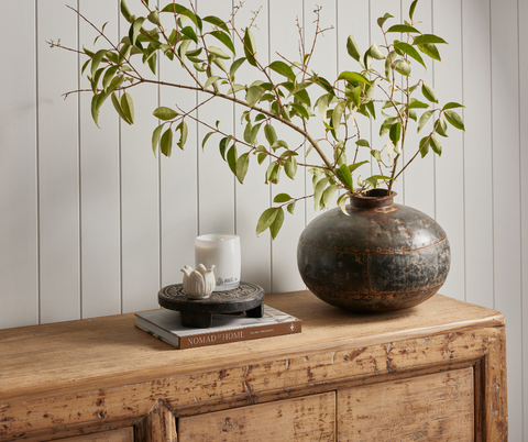 Vintage sideboard styled with vintage vase and small trinkets