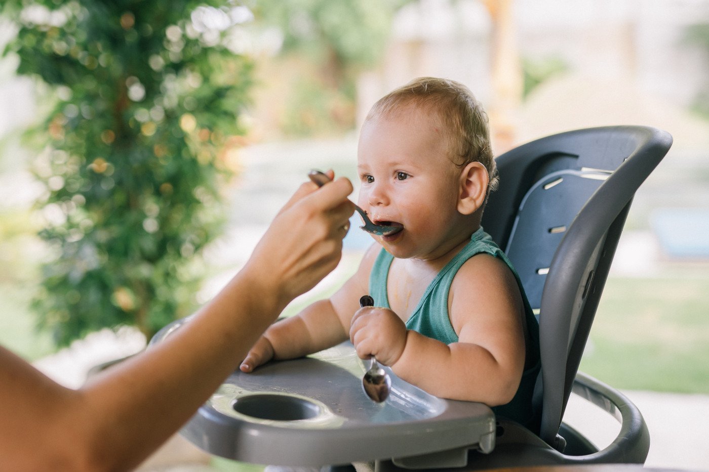 Baby in highchair eating