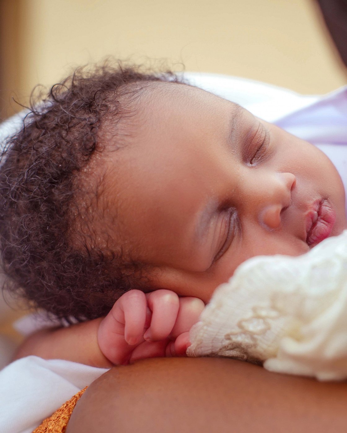 baby sleeping on mother's stomach