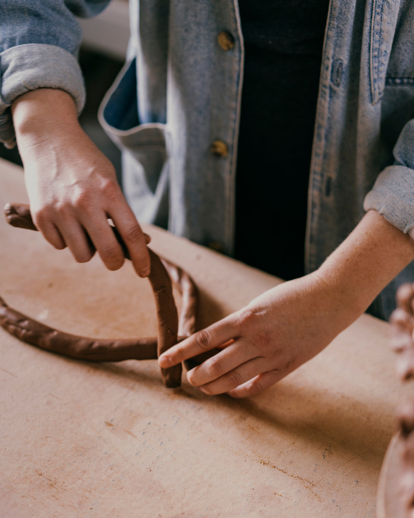hands braiding clay