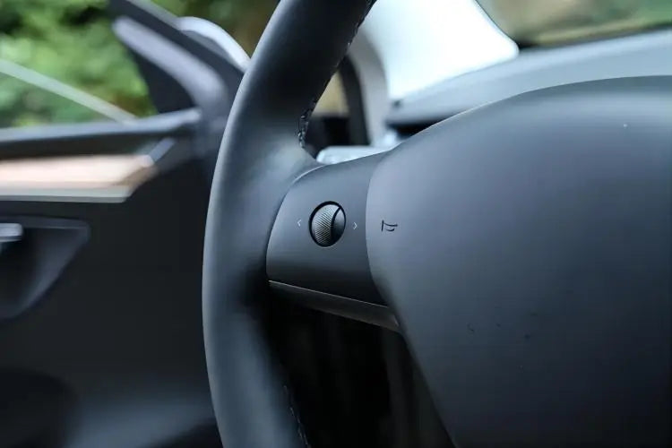 Tesla steering wheel adjustment buttons