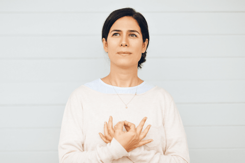 Woman with hands in a mudra