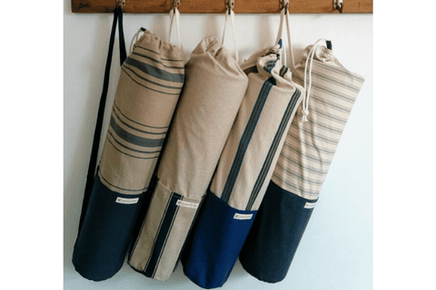 Common Texture Yoga Bags hung on rack