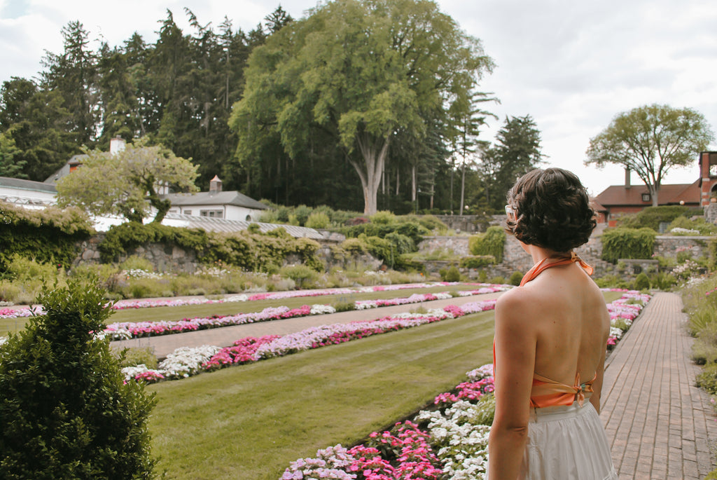 Fleur Sauvage founder, Maria Confer wearing the Soleil silk scarf as a knotted halter top