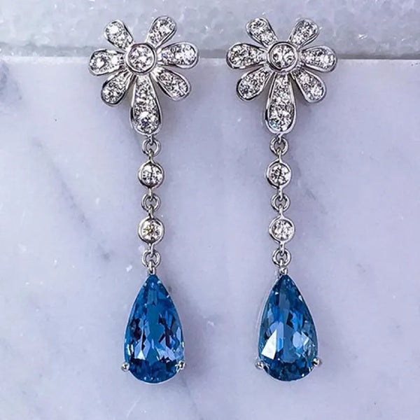Suna brothers ice flower earrings with blue gemstones
