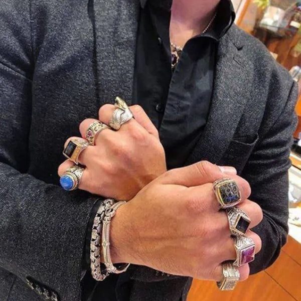 Mens hands with rings on each finger