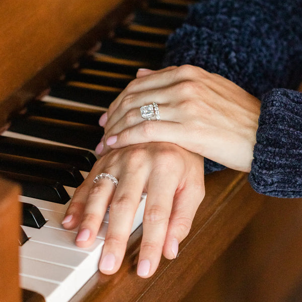 Diamond wedding rings on piano keys