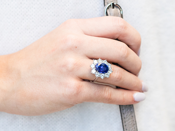 Sapphire and Diamond Ring on a Finger
