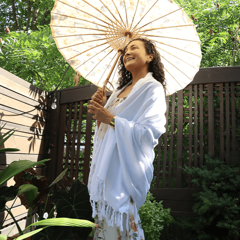 Woman wearing a Pomp & Sass Turkish towel as a shawl to a wedding