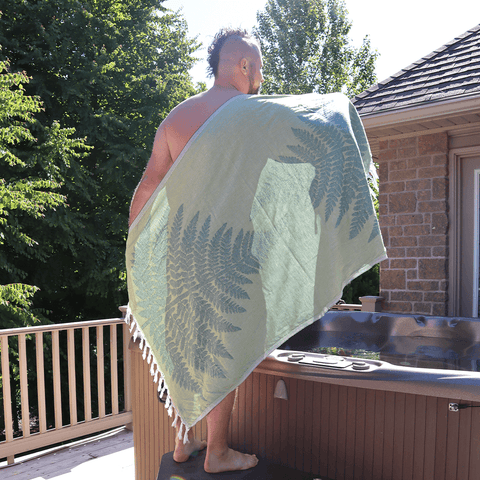 Man using a Turkish towel in the hot tub