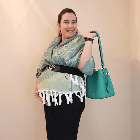 Pregnant woman uses her Turkish towel as a shawl