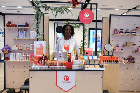 Toyin founder of I am a Pretty Kind stands in front of her booth at the RBC eXperience Market located in the Sherway Garden Mall 2022