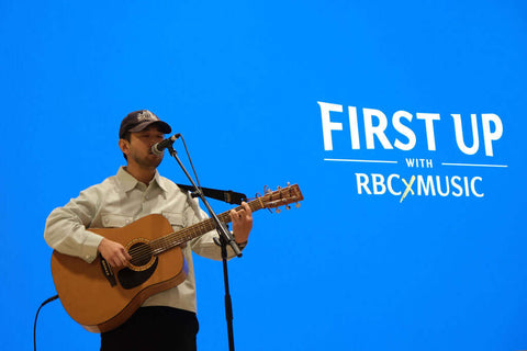 A man sings and plays the guitar in the RBC eXperience Marketplace located in Sherway Garden Mall 2022 