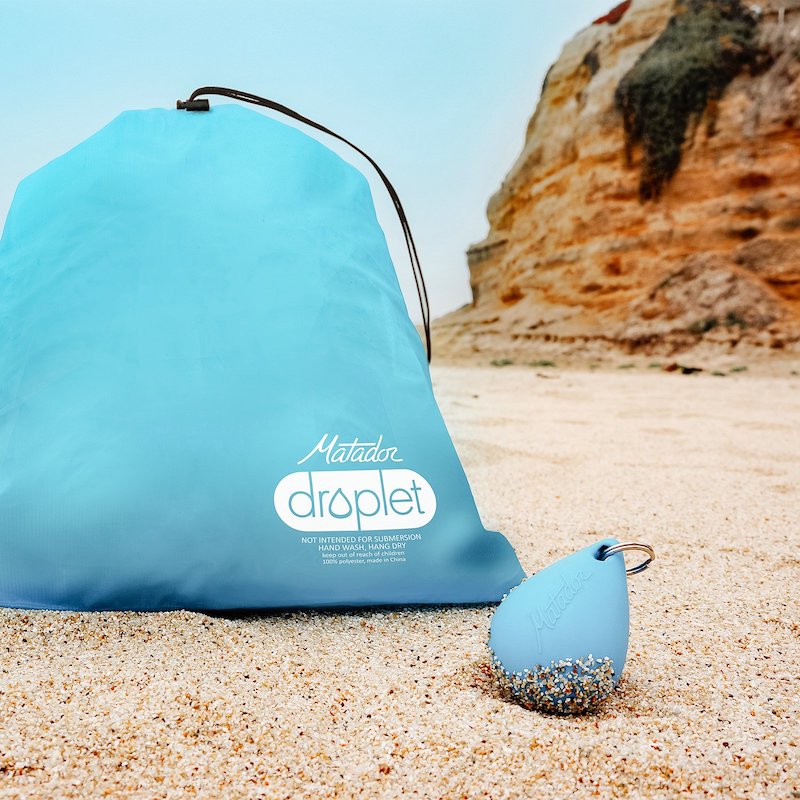 Product image of the Droplet waterproof bag, next to the keyring it fits into