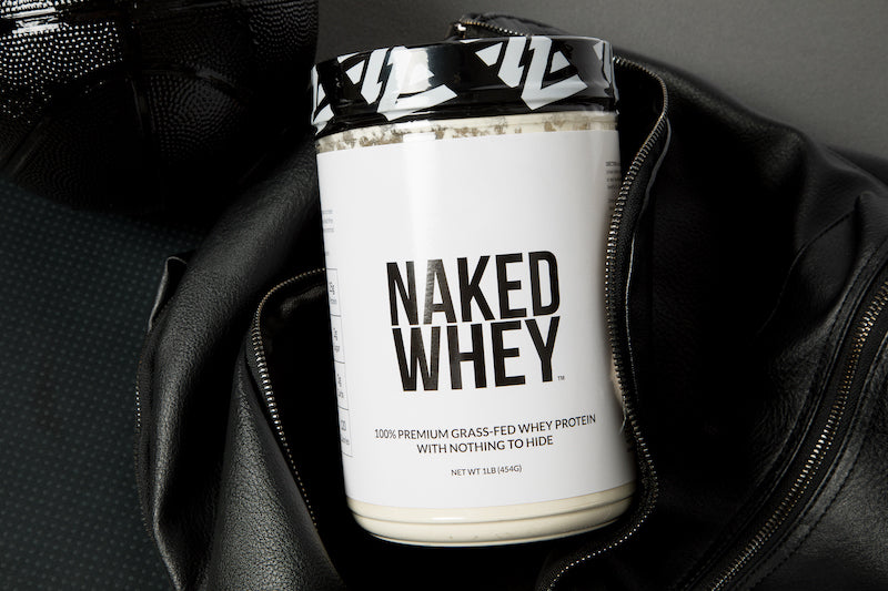 1lb tub of Unflavored Naked Whey in a gym bag