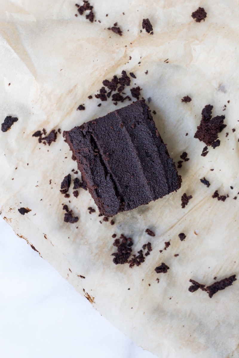 Chocolate whey protein powder brownie on parchment paper 