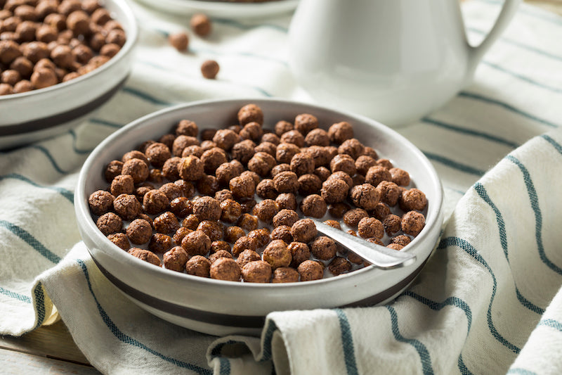 Bowl of protein cocoa puffs and milk 