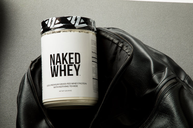 One pound tub of Naked Whey in a gym bag