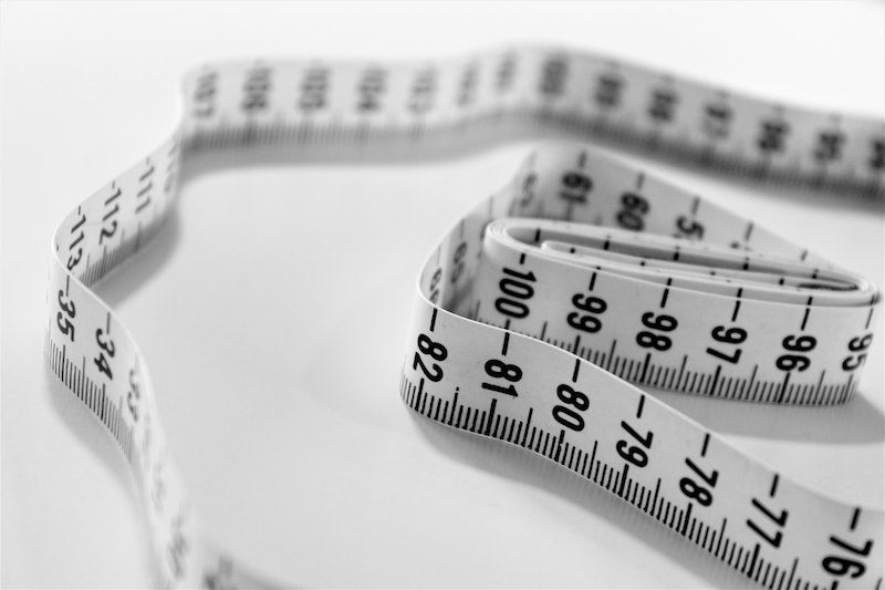 Tape measure on a countertop to signify weight loss