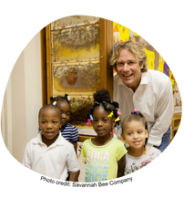 Man and children with honey comb