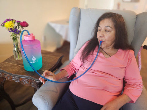 elderly woman using the best bedside water bottle