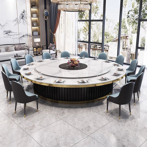 big round sintered stone dining table with 12 blue dining chairs around table in restaurant